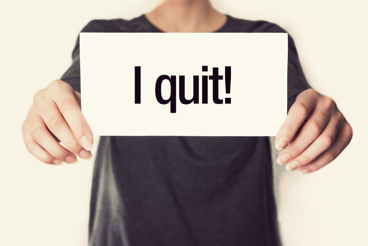 A sign says "i quit"